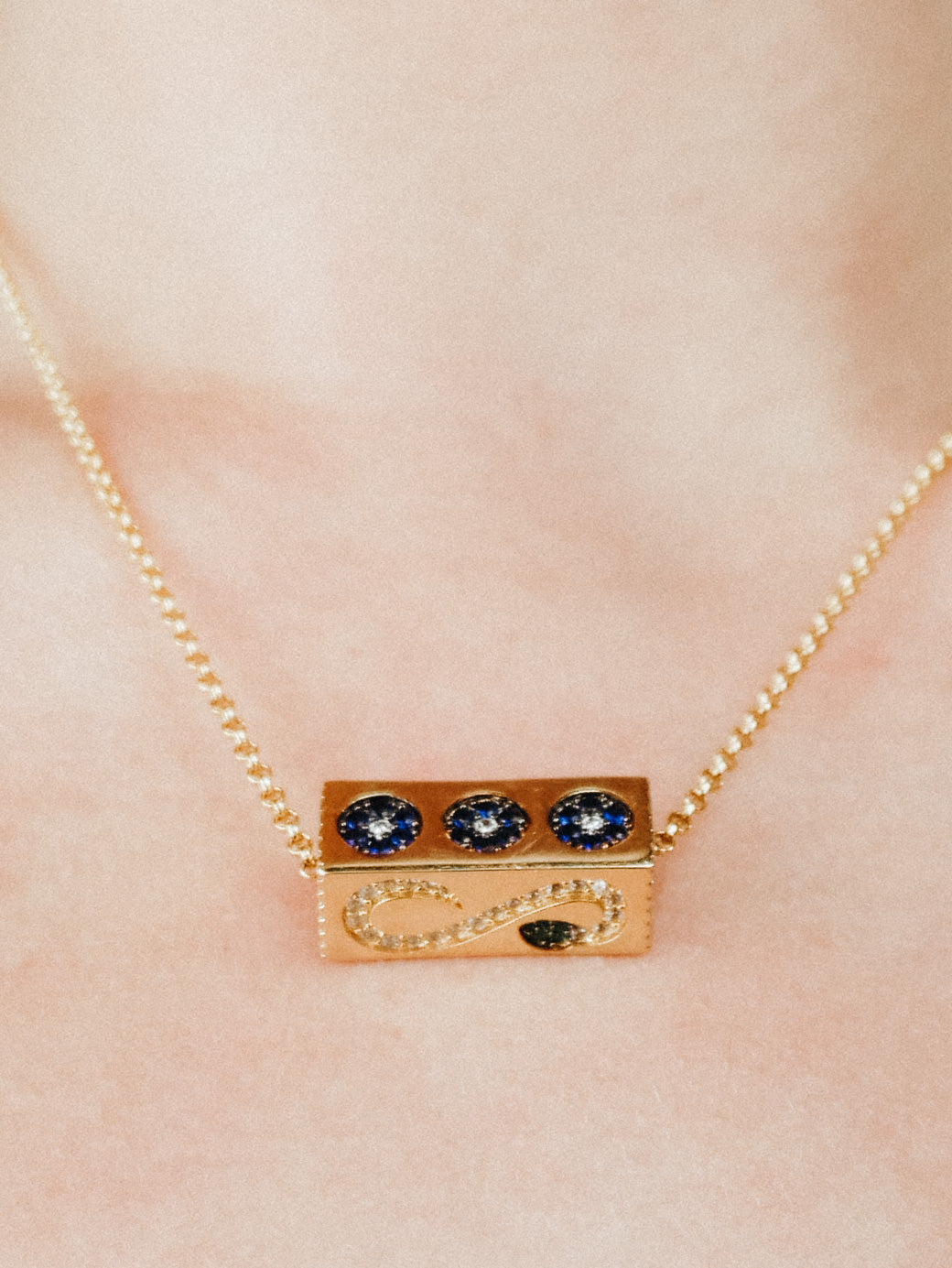 Gold cuboid rotatable element necklace