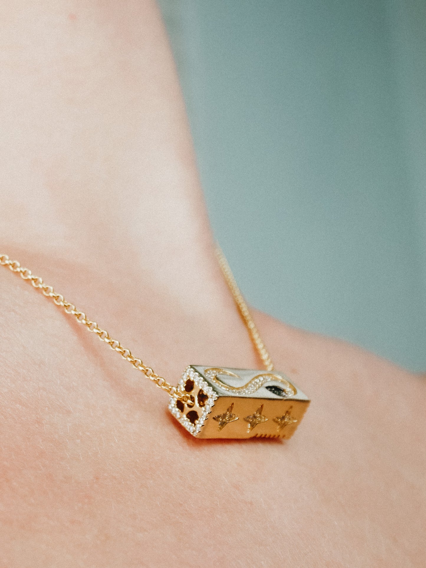 Gold cuboid rotatable element necklace