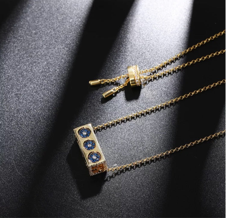 Gold cuboid rotatable element necklace
