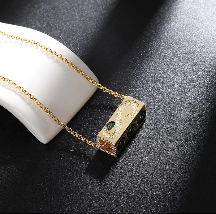 Gold cuboid rotatable element necklace