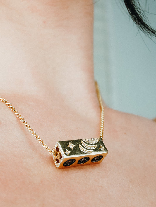 Gold cuboid rotatable element necklace